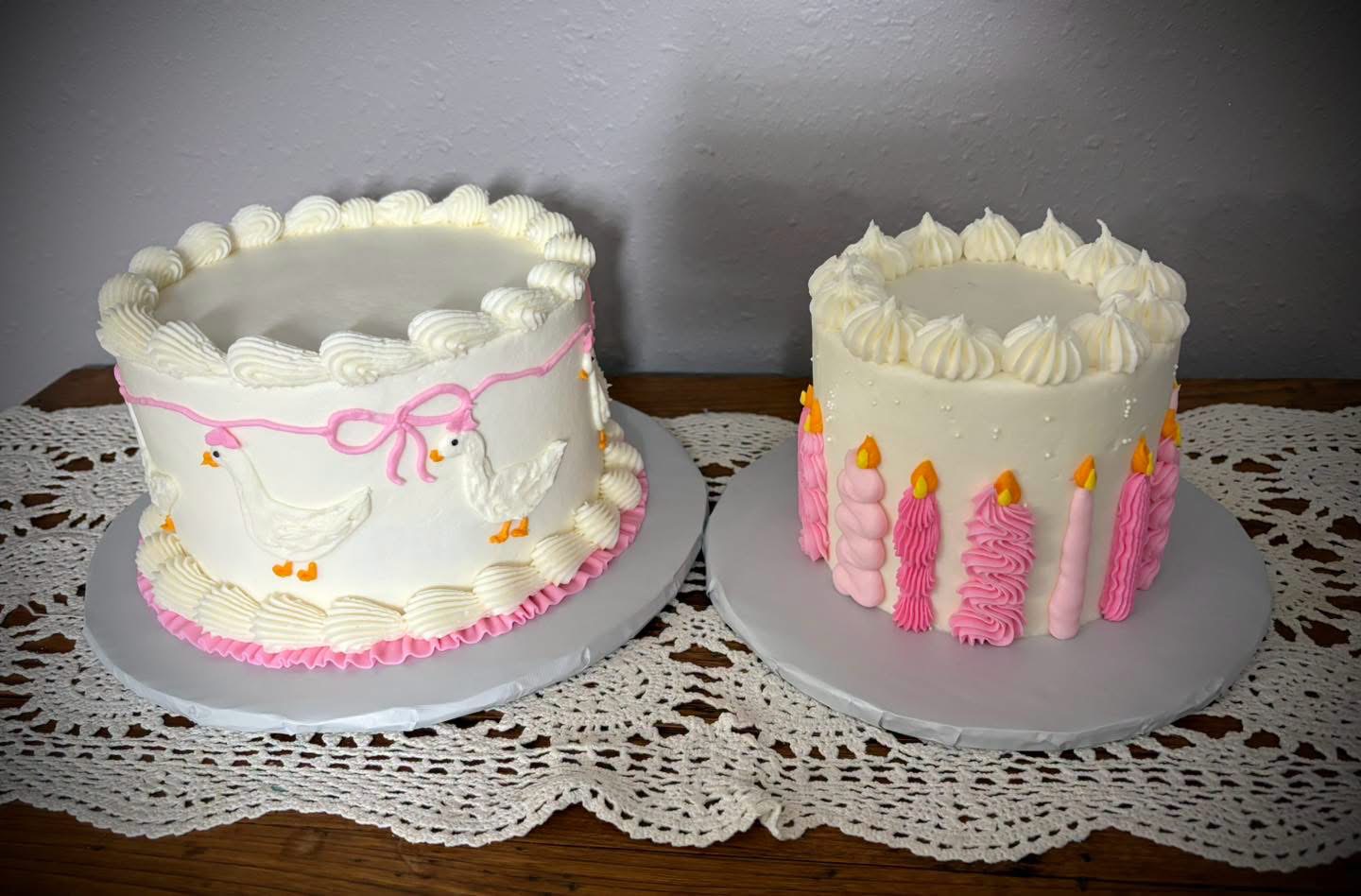 Geese with a bow, and a ring of pink candles