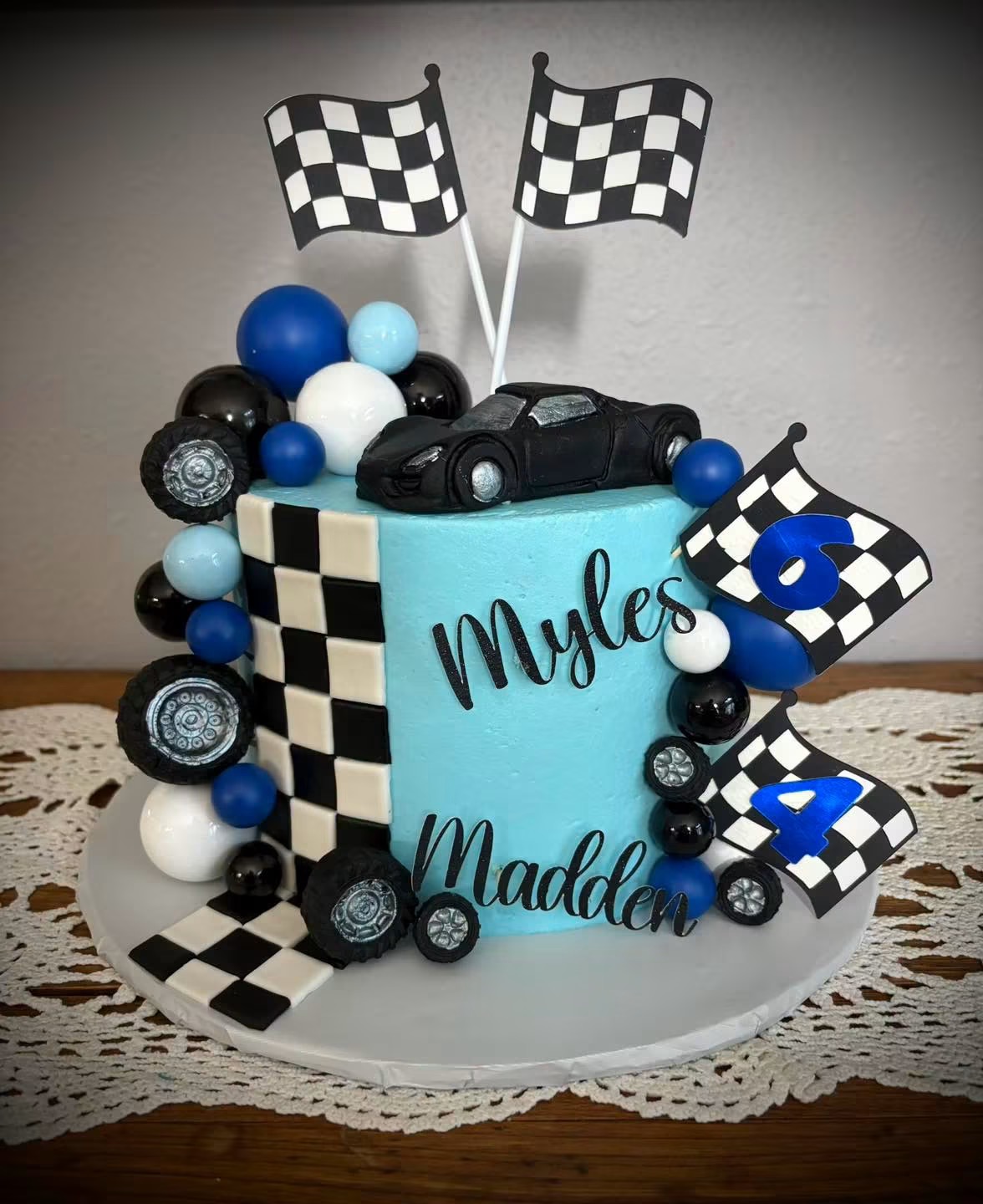 Racing into 6 and 4: a checkered-flag cake for Myles and Madden